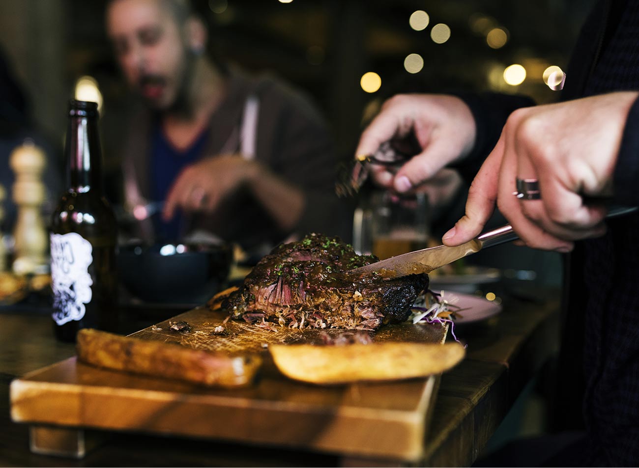 A chef slicing at the board