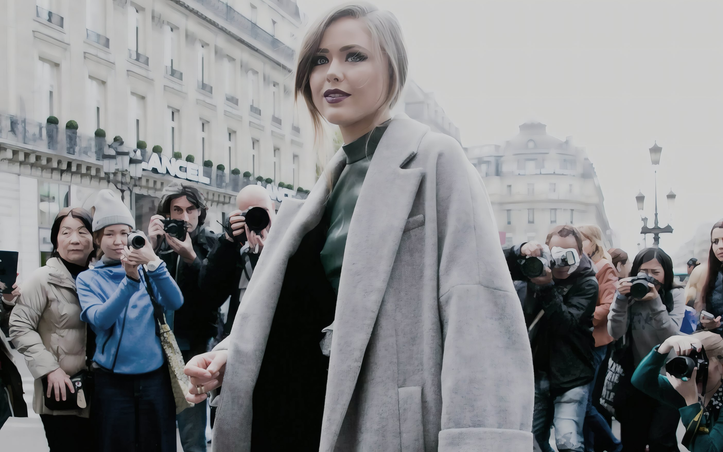 A grey coat outside the shows, photographers behind
