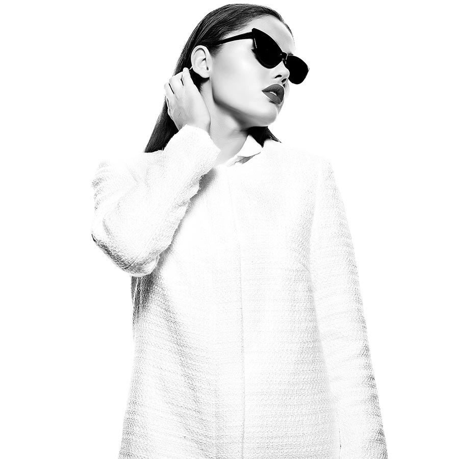 A white coat and dark glasses