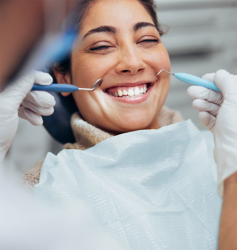 A smiling patient in the chair