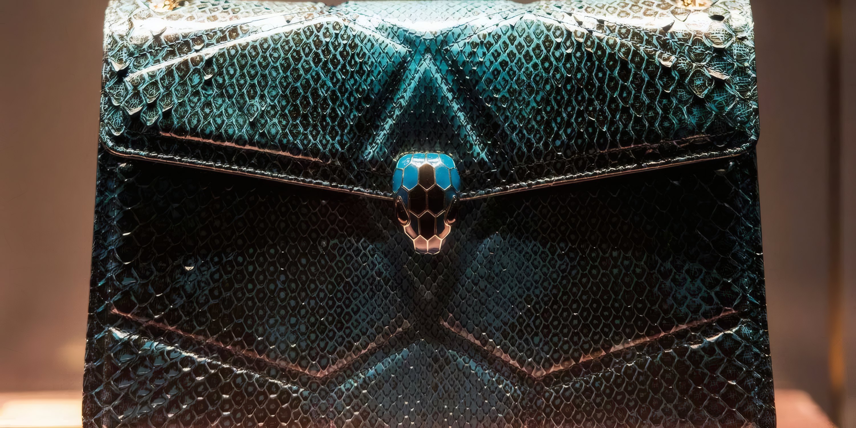 A teal snakeskin bag