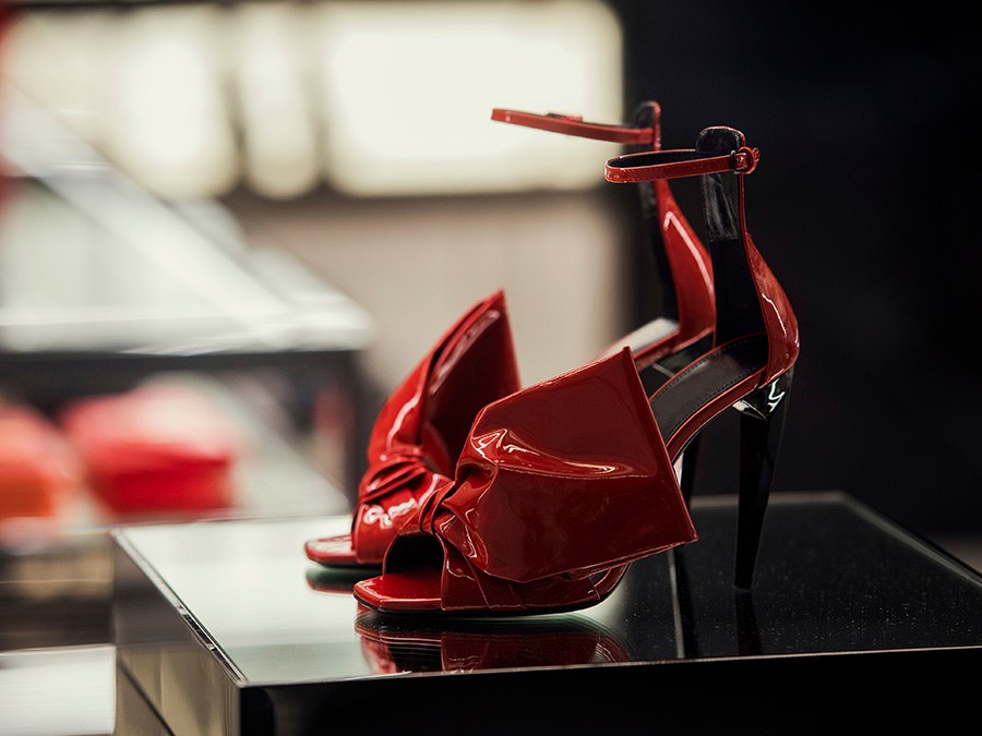 Red patent heels on a black table