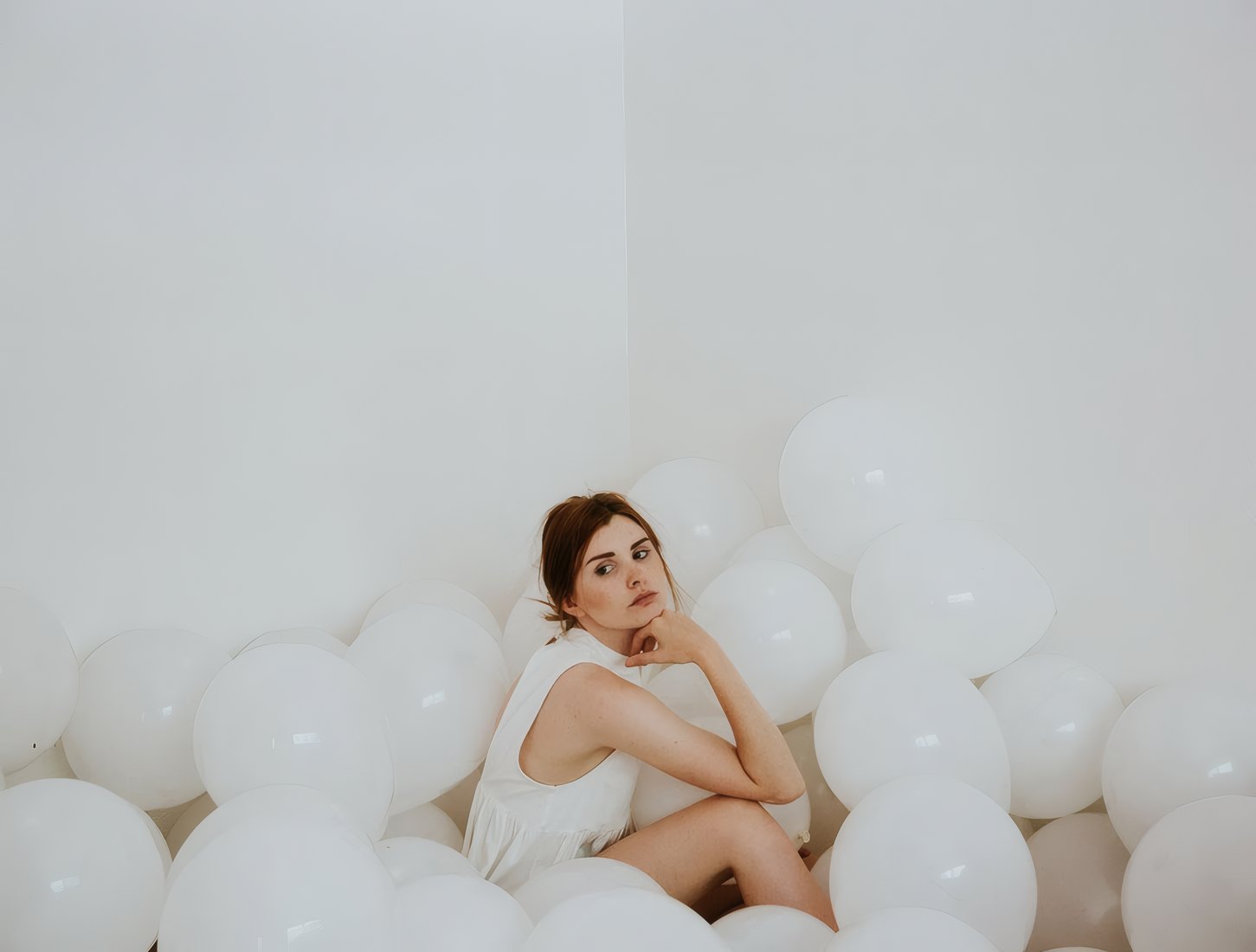 Shelf Apartment by Vanta Architecture, a white room filled with balloons