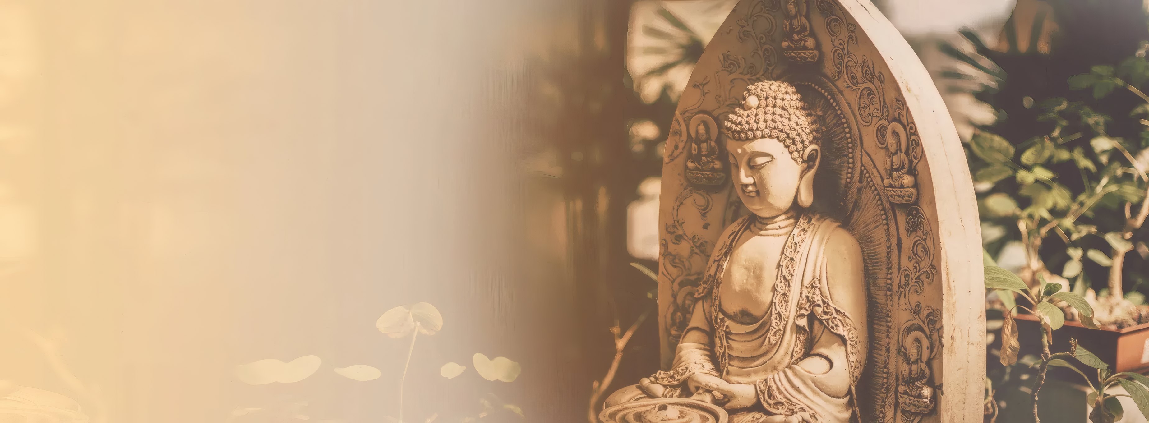 A carved stone Buddha in a temple garden