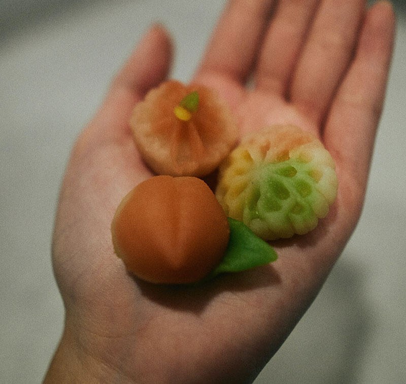 Three spheres held in the palm