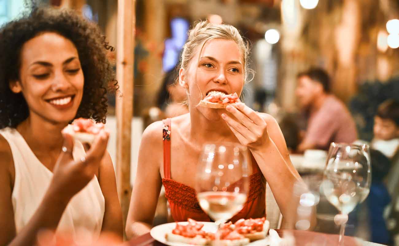 Friends eating the pies they made