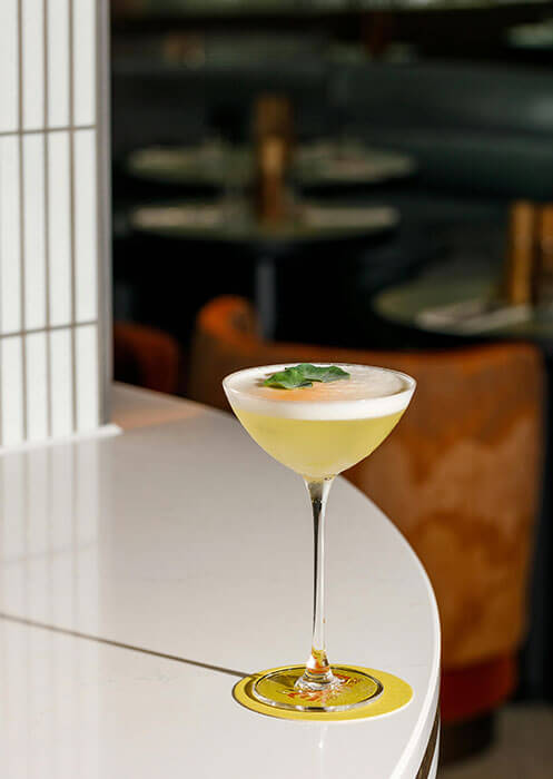 A pale coupe on a white table