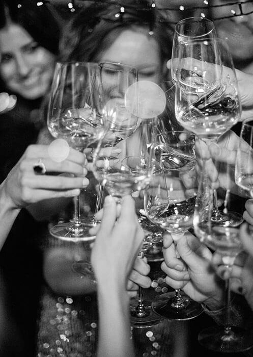 Friends toasting in black and white