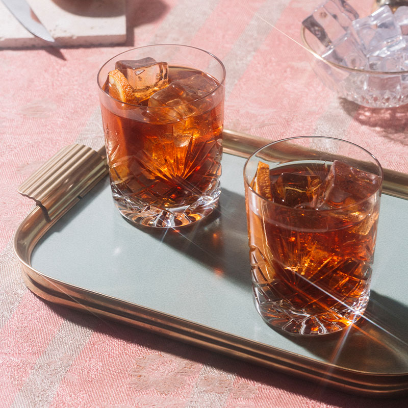 Two negronis on a mint tray