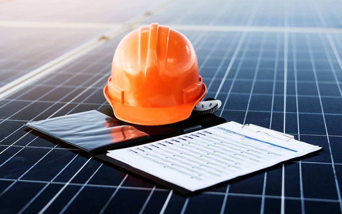 A hard hat and a drawing on a solar panel