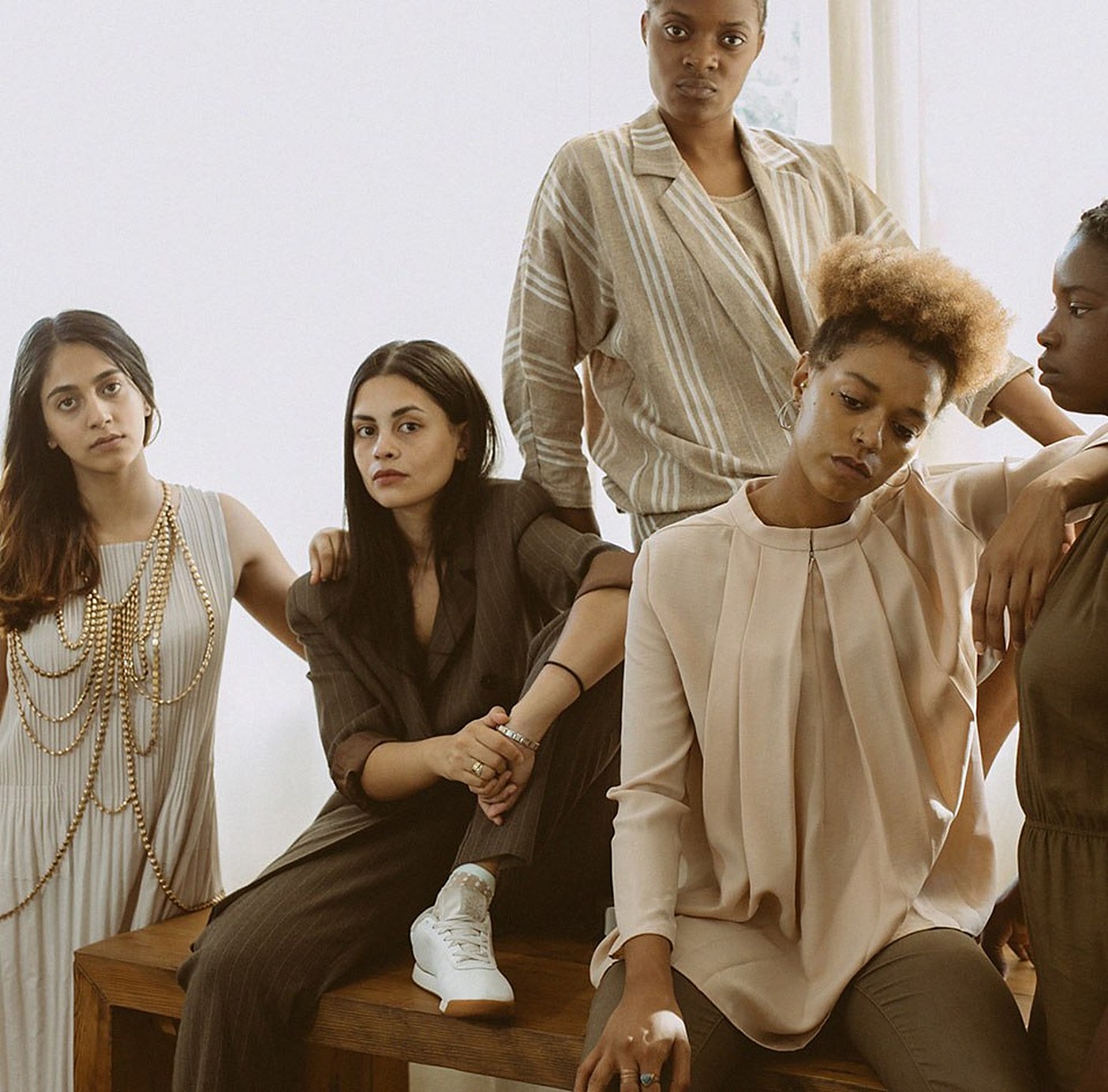 Five women in tailored neutrals