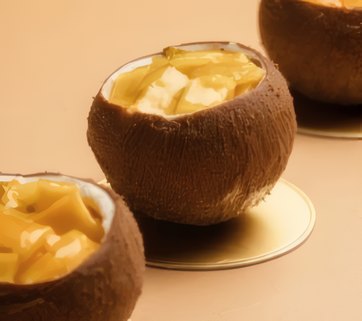 Coconut cups filled with mango cream