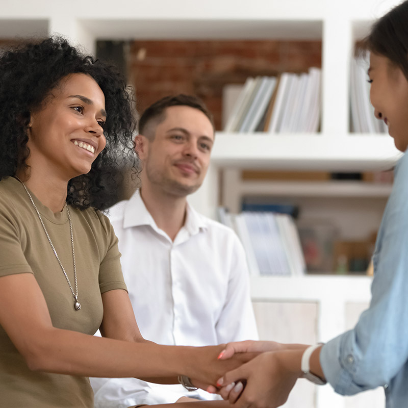 A receptionist welcoming a client