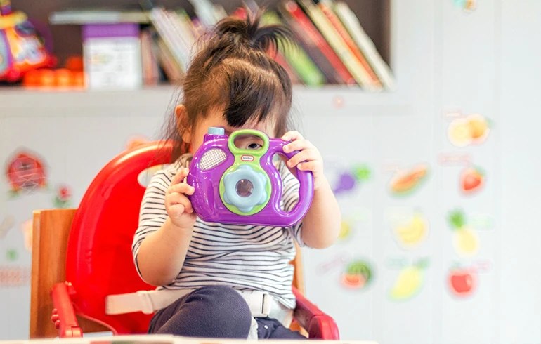 Toddler laughing at story time