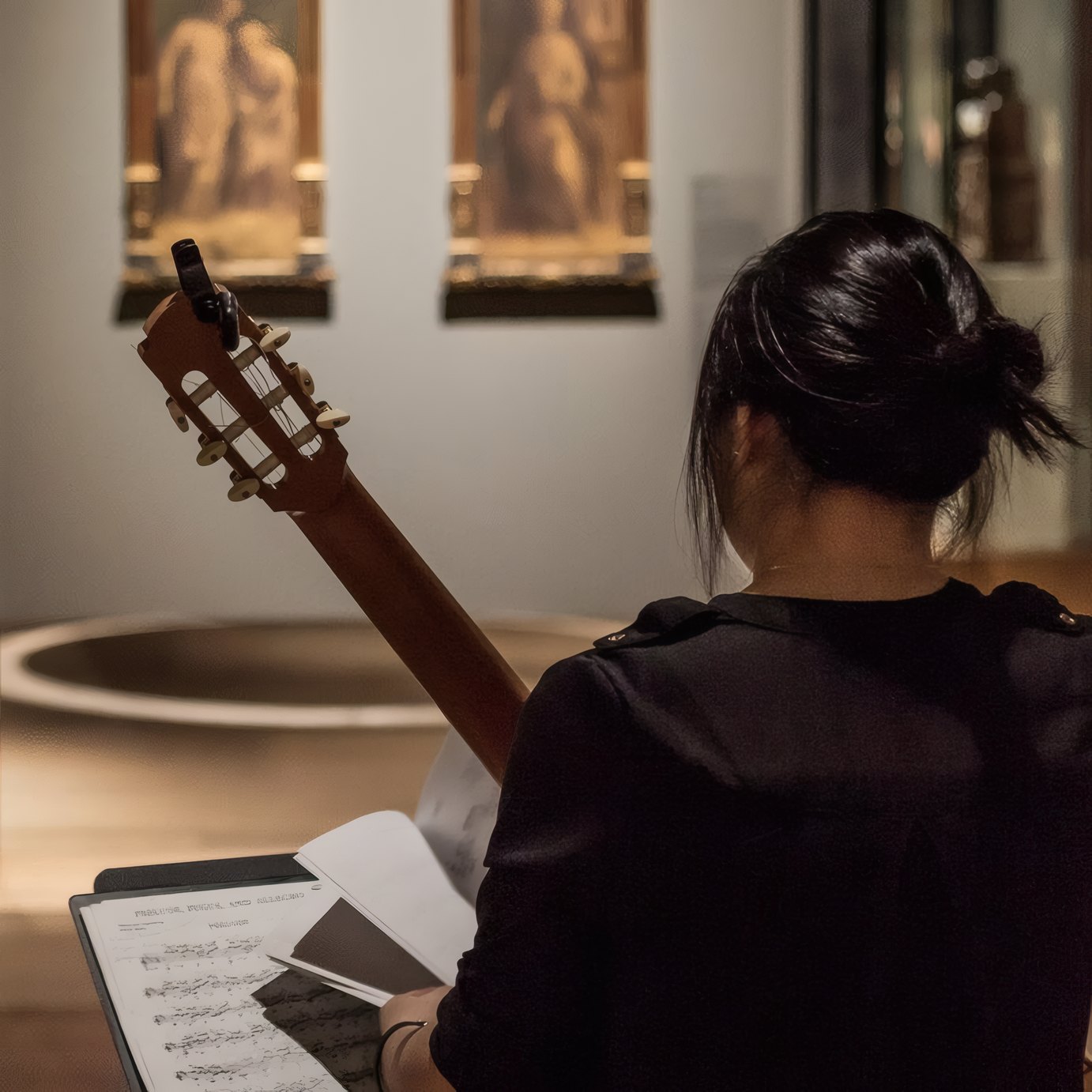 A musician in the galleries after dark