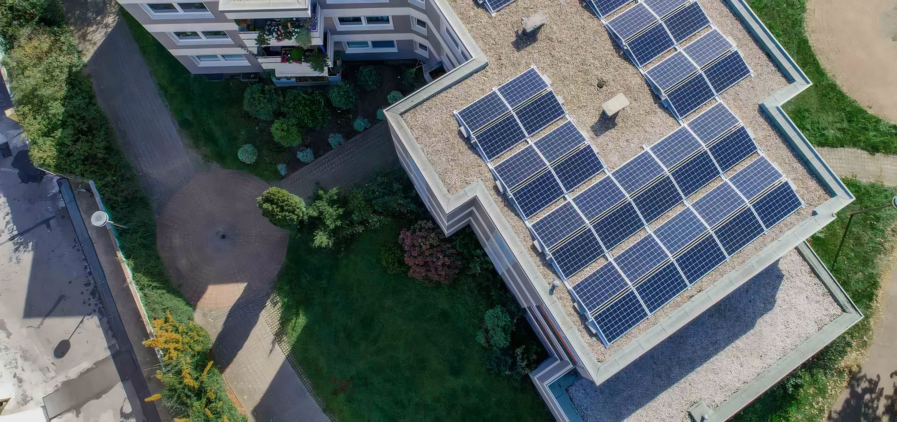 Flat roofs covered in solar modules, from the air