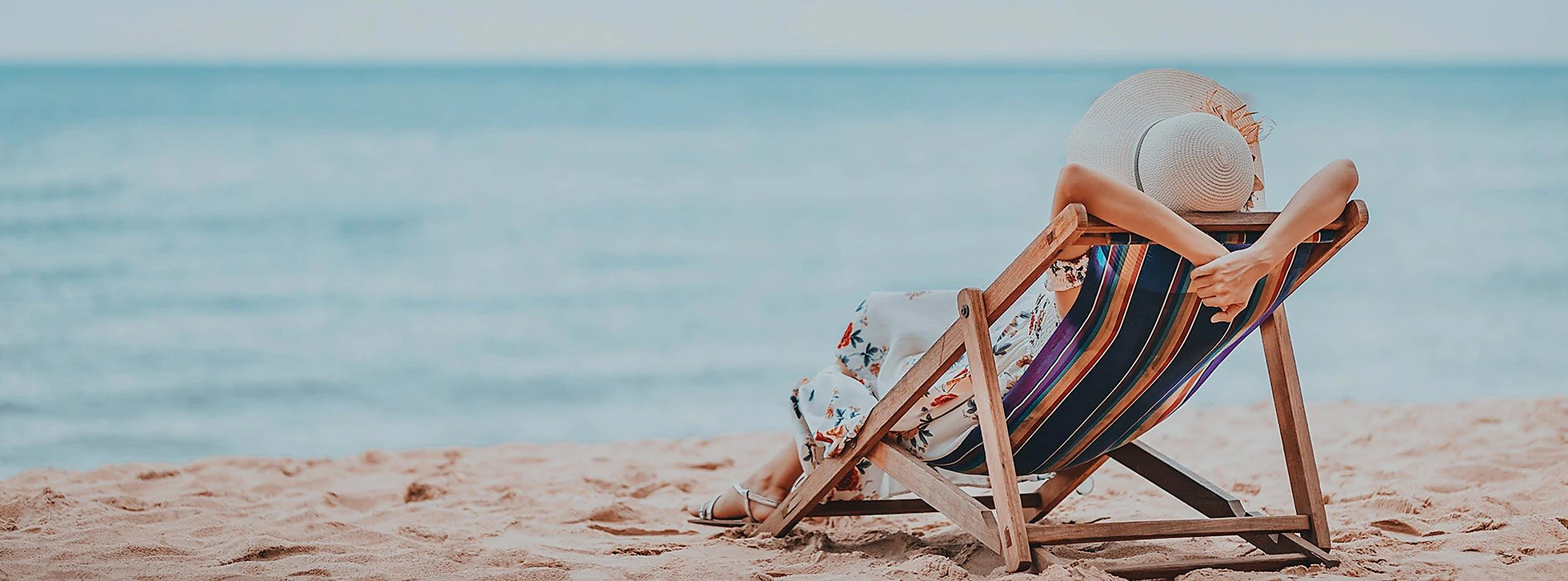 A guest relaxing beside the surf pool