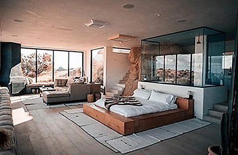 A bright bungalow room with a view of the palms